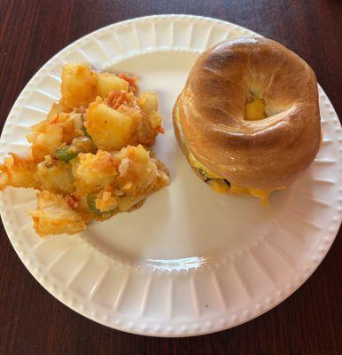 Bacon, egg, cheese bagel, a side of potatoes, and a can of Diet Coke (not pictured) for 10 bucks.