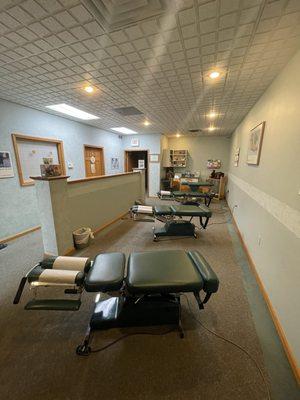 Open room concept with multiple Flexion/Distraction tables available for treatment
