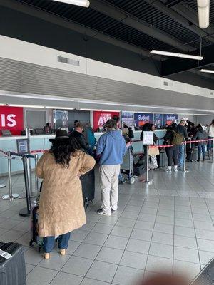 2nd Avis employee just came out. We've been here 20 min and seen 1 person move