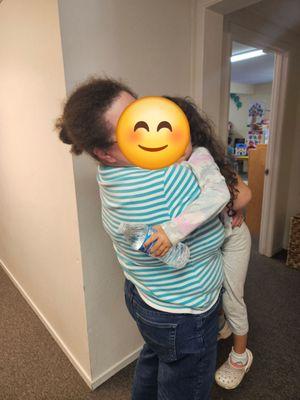 My daughter's last day in Ms. Melinda's arms at Happy Time before graduating to Kinder.