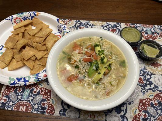 Chicken soup with homemade tortilla chips.