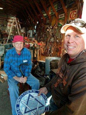 Visiting with John next to the warming fire. Keeping toasty.