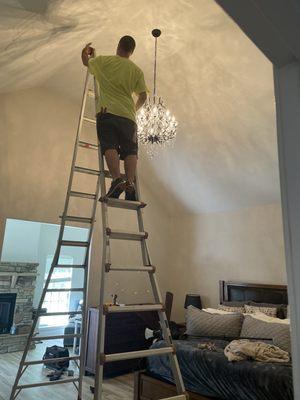 Evan hanging the chandelier!