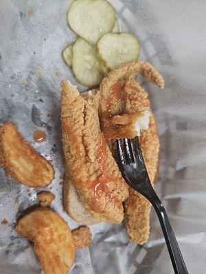 Catfish sandwich with fries