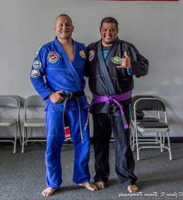 Richard earns his purple belt. Also pictured, Professor Malone.