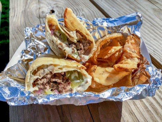 Brew-Rito: sautéed veggies, beef, mozzarella, beer cheese in fried tortilla.