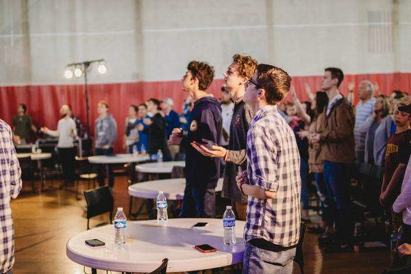 People engaged in worship.