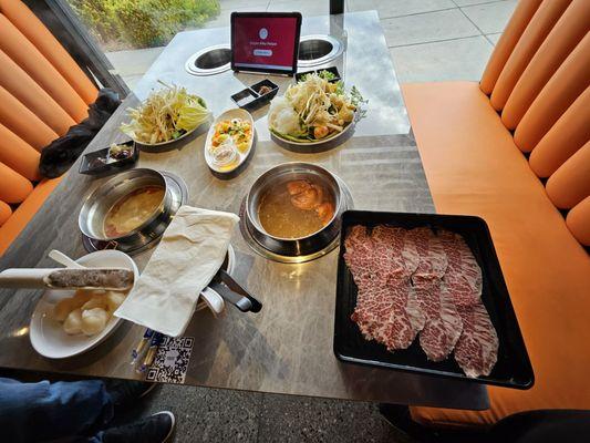Pre cooking setup with some veggies, meats and seafood.