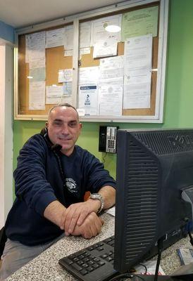 Ahmad answering customers question in regards of their vehicle.