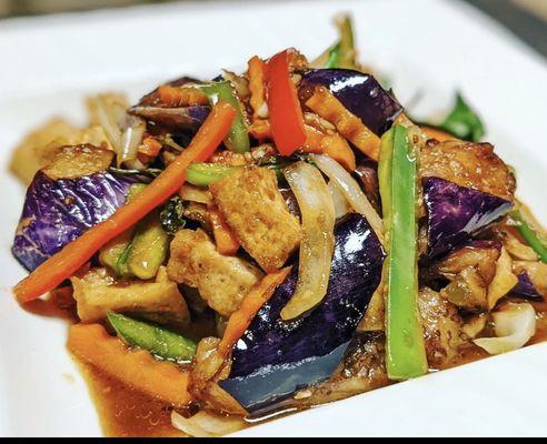 Basil eggplant. eggplant,bell peppers,onions,carrots,and basil suteed in house garlic sauce with choice of protein
