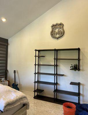 Paint, bookshelf, hung sign