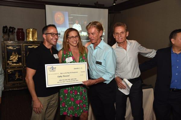 Presenting checks to some of our beneficiary agencies.