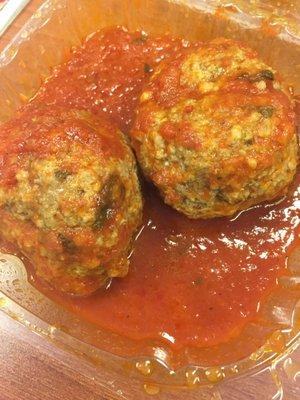 Homemade meatballs in homemade sauce.