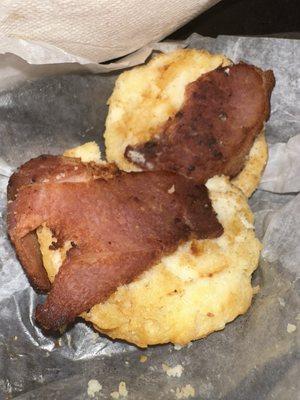 Ham burnt on an old biscuit served for breakfast.