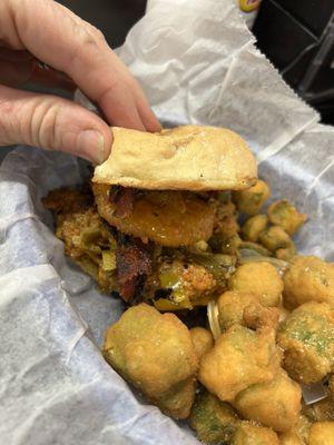 They always make me a mini burger because they're huge and they know I can't eat them all. This is a mini cowboy with fried okra.