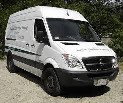 One of Breckner , plumbing and heating's vintage vans