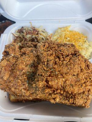 Pork chops with grits and hash browns.