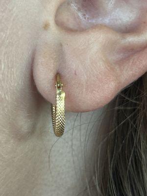 he placed it there to avoid my past scar tissue. he also chose that spot becuase i'm able to fit 3 earrings on my earlobe.