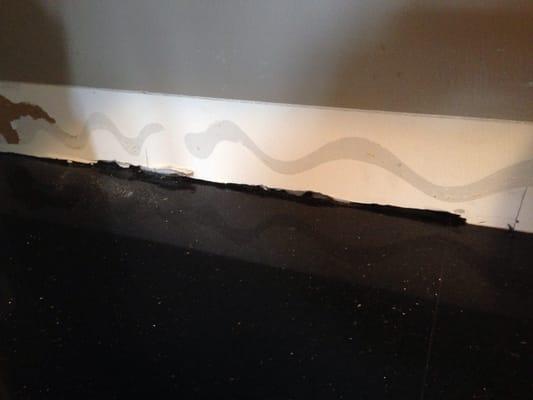 Instead of being square they cut into my wall to fit the piece.