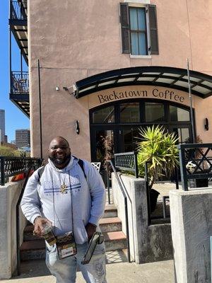 Malik our tour guide, meeting at black owned coffee shop.