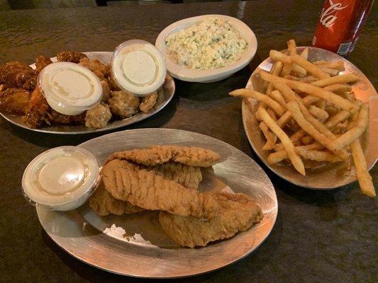 The $5.79 fries, the $5.79 weird tasting coleslaw and the "generous" extra piece of chicken tender to our order. So disappointed