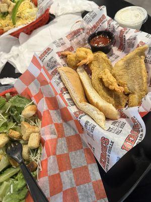 Side Caesar salad and seafood basket