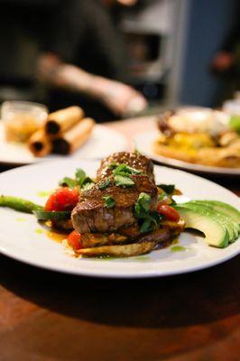 Lomo saltado and soyrizo "firecrackers" with smoked gouda, serranos and golden raisins