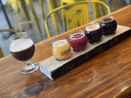 Nitro cold brew to the left. 4-beer flight to the right