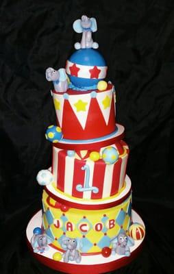 Topsy turvy circus theme first birthday cake