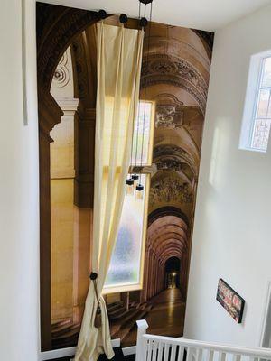 Stairwell mural and window treatment.