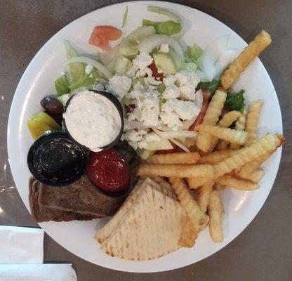 Greek platter, with Greek salad sans pepperoncini, a few kalamata olives, feta, and a watery, oily Greek dressing. Great gyro meat, though!