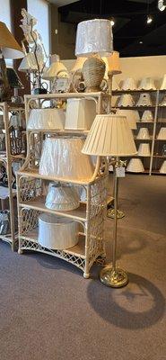 Many lamp shades and beautiful Philippine wicker furniture.