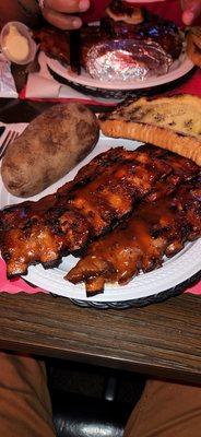 Ribs, bread, baked potato