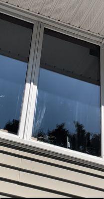 Outside view; poor attempt to clean outside of my windows. This was marks left with the tool that ruined my window