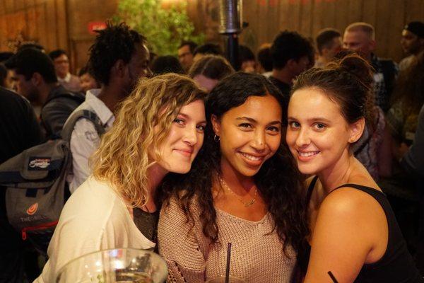 Los Angeles locals, expats, and travelers mingling in Santa Monica, speaking in many different languages.