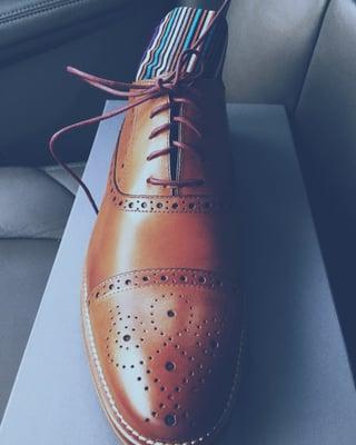 Conrad Cap Toe. Very versatile shoe that compliments both a pair of dress slacks (suit) and jeans. Socks are navy base stripe
