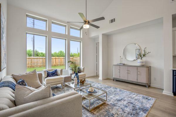 Vacant Staging - Home Builder Inventory Home - Living Room with blue accents