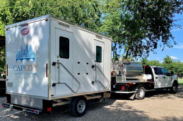 Climate controlled two station trailer with running water, mirrors, soap and paper towels in individual entrances.