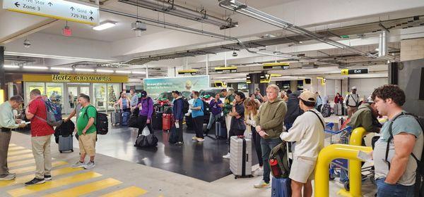 People waiting for a car. I was told many had already waited 2 hrs.