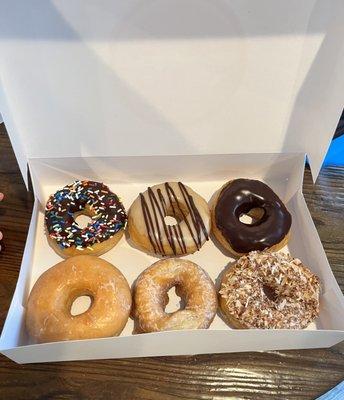 Chocolate sprinkles, maple iced, chocolate iced, glazed, sour cream & toasted coconut
