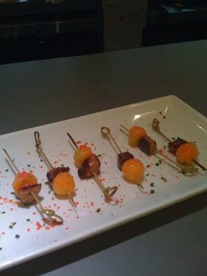 Seared foie gras, melon & poprocks hor's douevre served at wedding catered by Cafe Nola