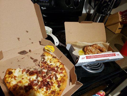 Beef, bacon pizza on garlic parmesan sauce. Parmesan bread twists