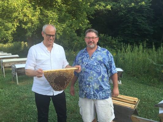Checking out the topbar hives with Charlie the beekeeper.