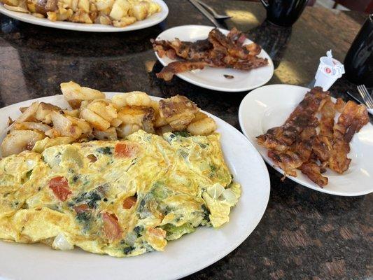 Omelets home fries, bacon.