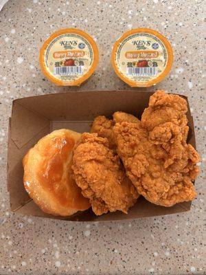 Chicken Tenders with a biscuit. Honey mustard dipping sauce.