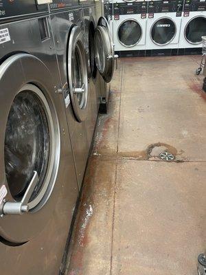 Machine leaking and spraying in the floor. Look at the build up