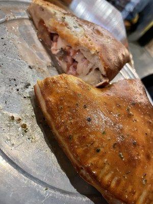 Stromboli with mozzarella, ham, and mushrooms