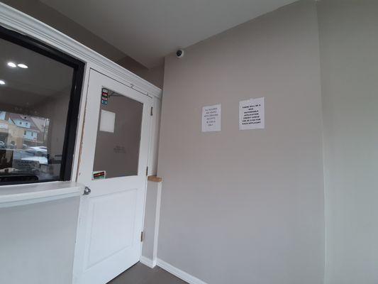 Sign in the office: $100 fee per applicant, in violation of the recent NY State law requiring a $20/applicant limit.