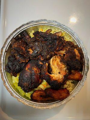 Jerk chicken with spinach rice, plantains, and steamed cabbage
