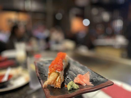 Delicious sushi roll with shrimp tempura inside